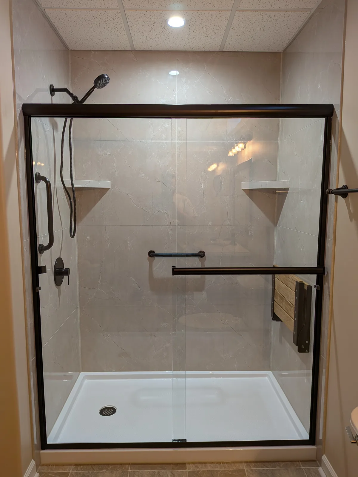 Finished bronze-framed shower from the bathroom