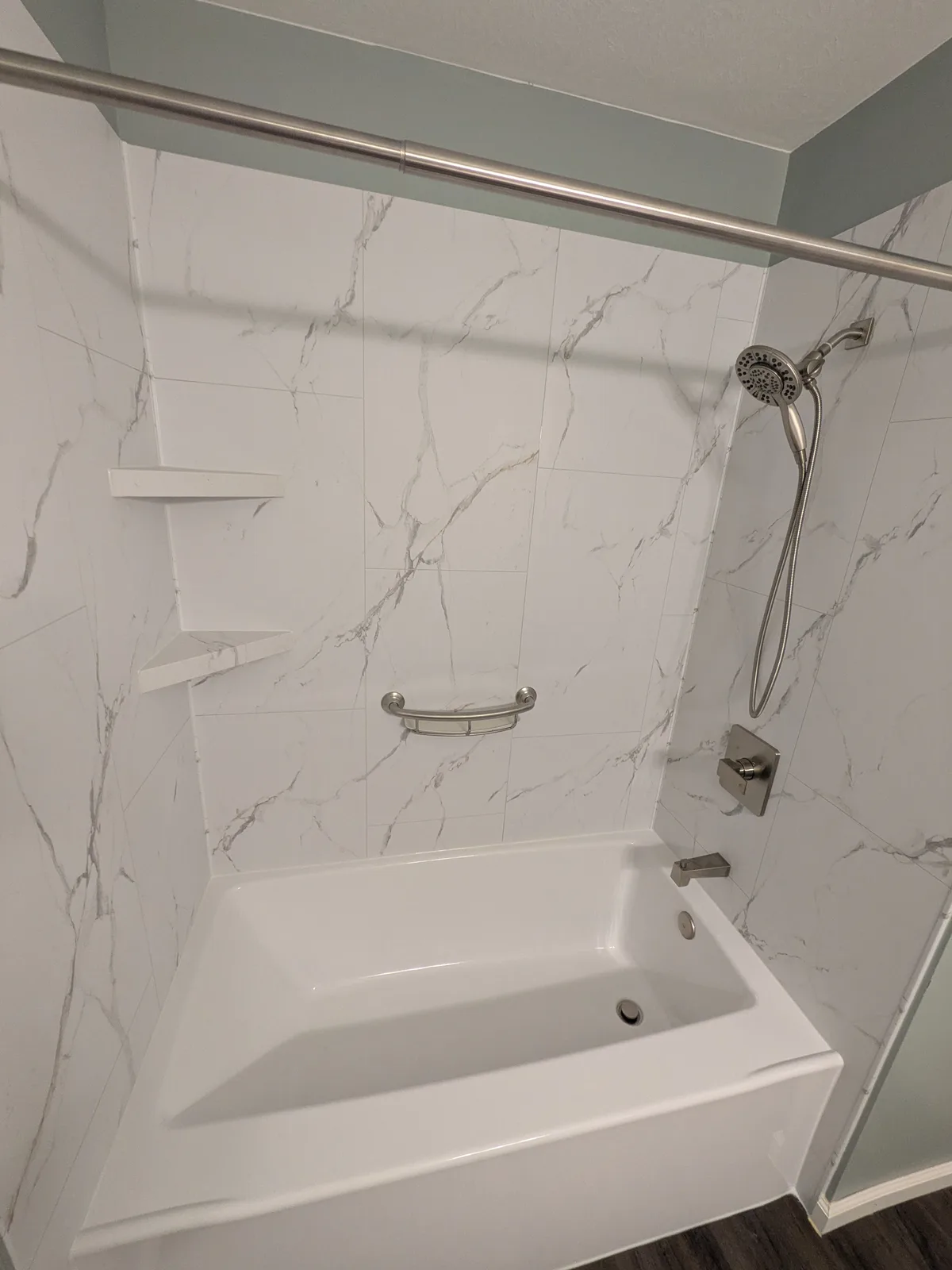 Tub alcove looking toward the shower fixtures