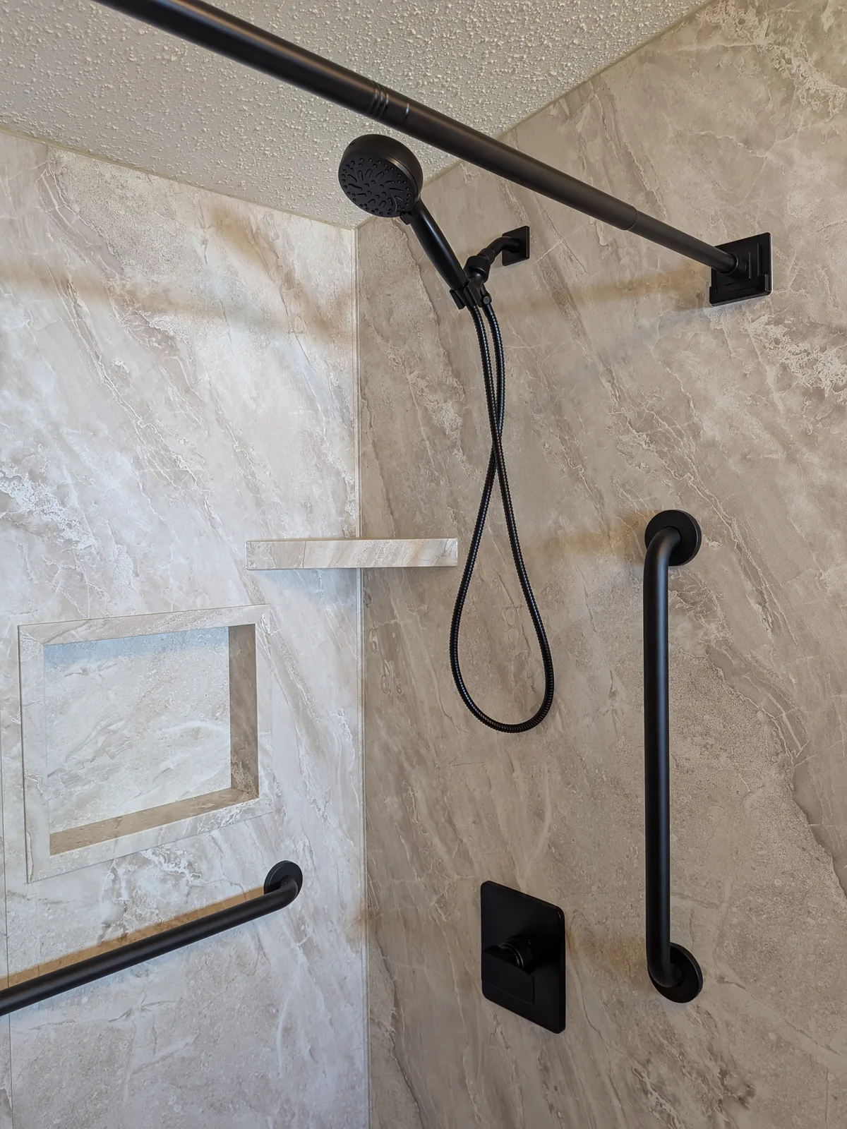 Vanity wall and shower after the full bathroom remodel