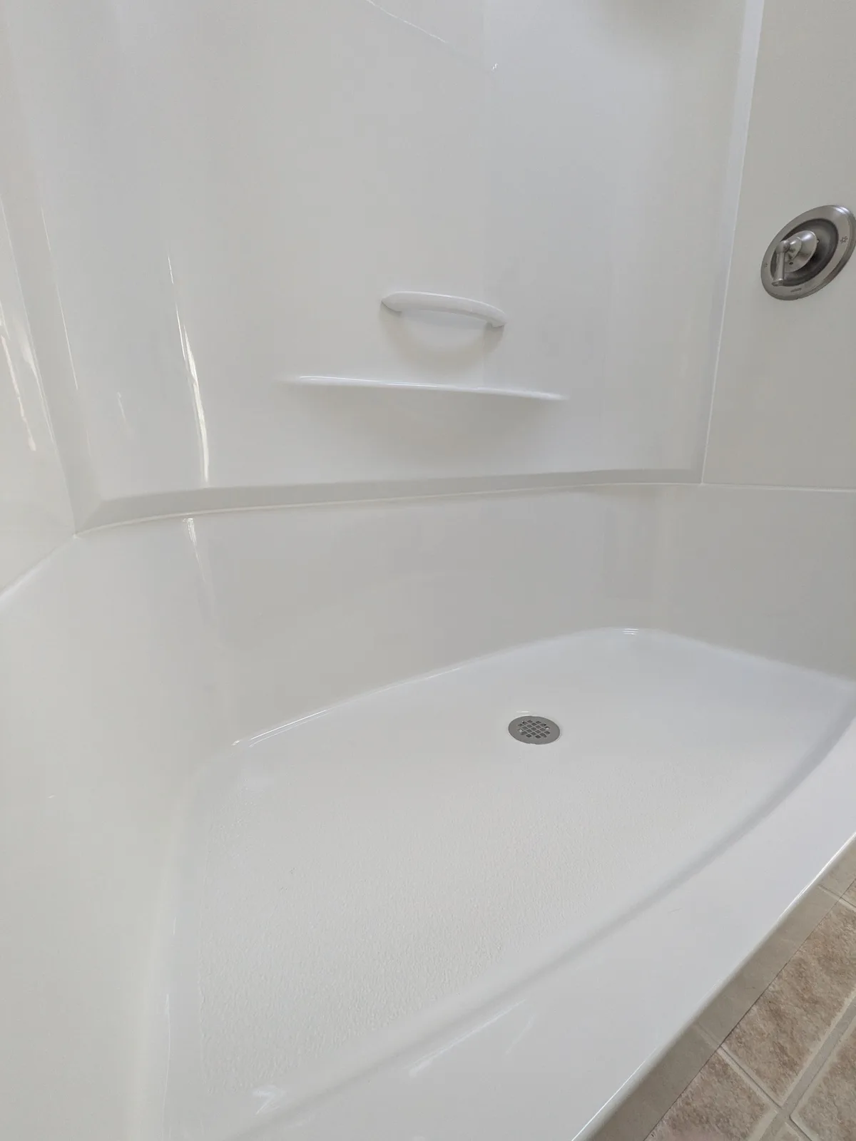 Inside the new tub surround, clean and sealed